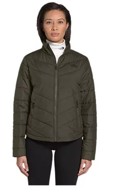 Woman wearing a green North Face quilted jacket.
