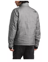 Load image into Gallery viewer, Man wearing a grey North Face puffer jacket. Back view.
