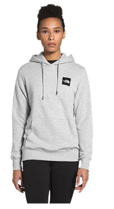 Woman wearing a The North Face grey hoodie.