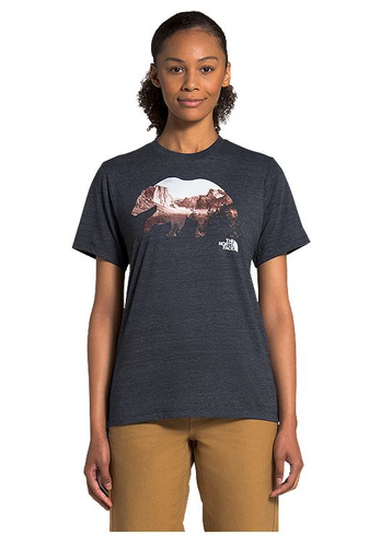 Woman wearing a grey The North Face graphic t-shirt.